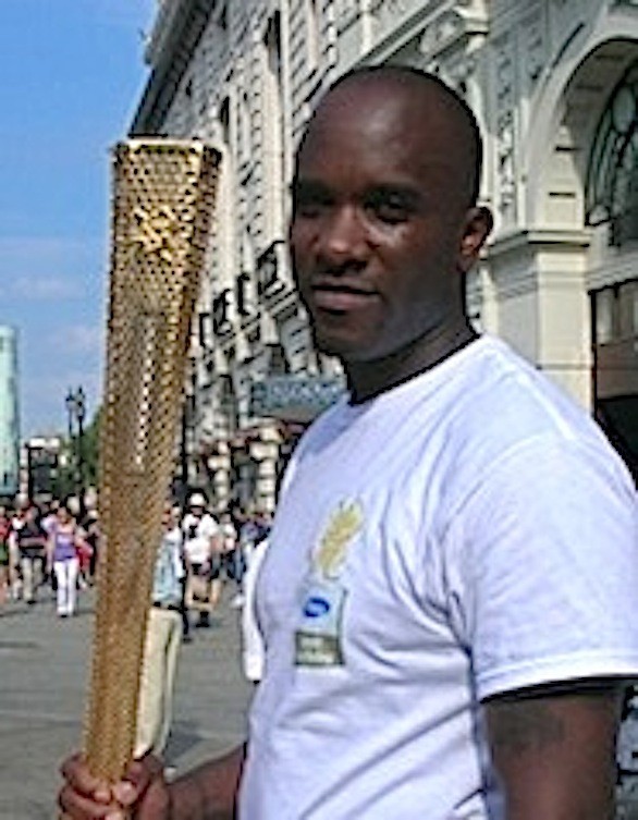 Phoenix James with the Olympic Torch in London